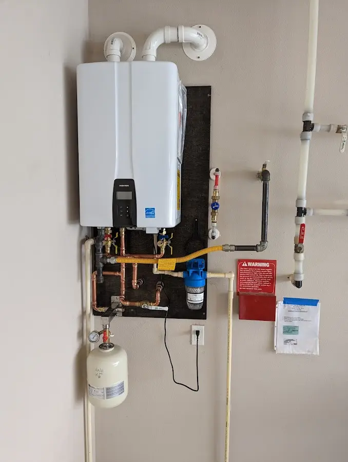 Professional plumber installing copper piping in a Cherokee Village home